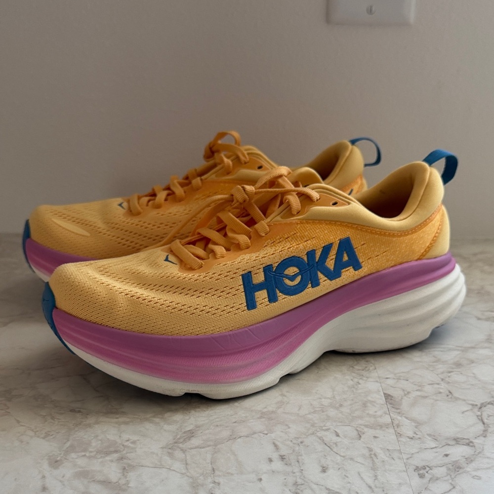Hoka Women's Yellow Running Shoes with Pink Midsole and Blue Logo